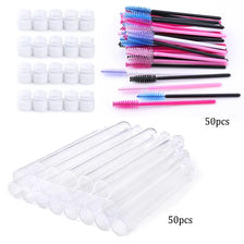 A collection of colorful mascara wand brushes and clear plastic applicators for eyelash makeup.