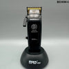 A black SmartBrain digital brushless hair clipper with a gold-colored housing and magnetic attachment.