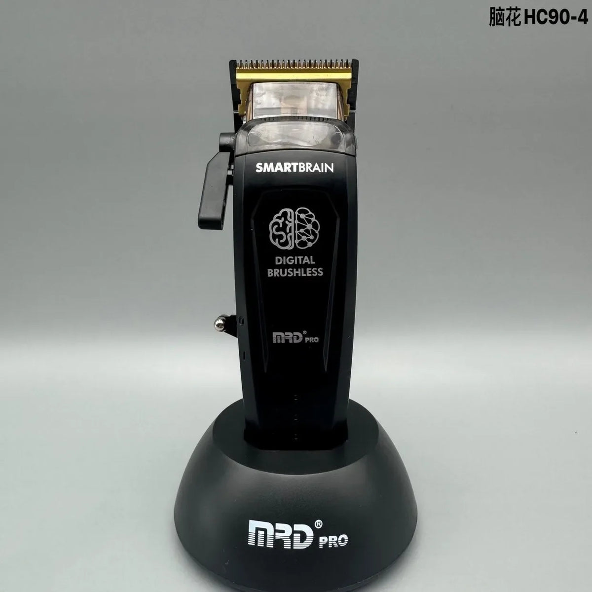 A black SmartBrain digital brushless hair clipper with a gold-colored housing and magnetic attachment.