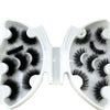 A pair of natural mink striped false eyelash extensions displayed in an open packaging box.
