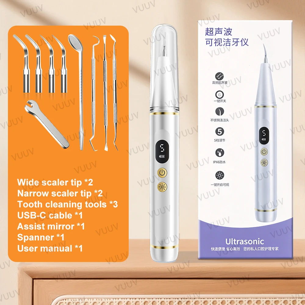 A white ultrasonic dental scaler device shown next to various dental cleaning tools and accessories.