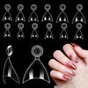 A collection of medium clear almond acrylic nail tips displayed against a black background and on a hand.