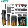 Set professioneller Haarschneider und Trimmer-Werkzeuge in schwarz-goldener Verpackung.
