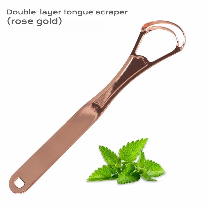 A rose gold double-layer tongue scraper is shown next to a sprig of mint leaves.