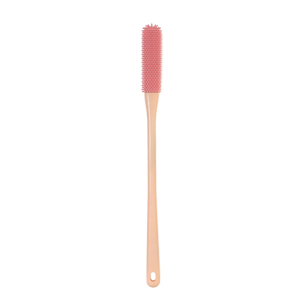 A pink long-handled manual foot scrubber with a bristled head.