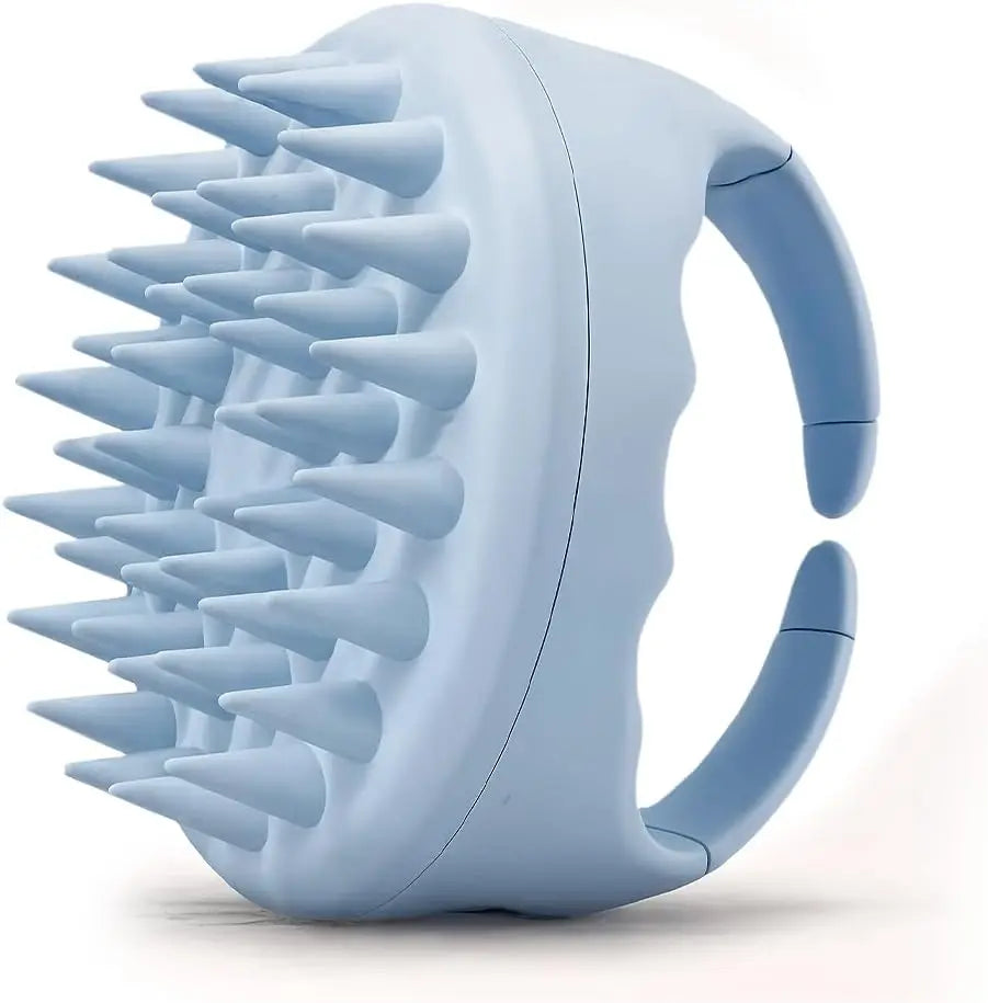 A light blue scalp massager shampoo brush with soft silicone bristles shown from the side.