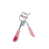 A stainless steel eyelash curler with a precision comb and pink silicone handles.