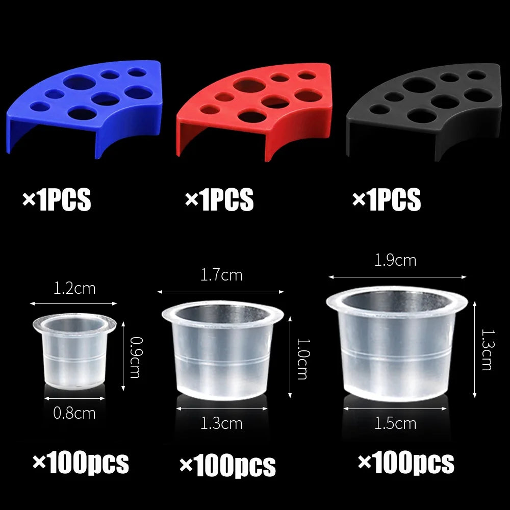 Set of three colored plastic tattoo ink cups with holders in various sizes and quantities