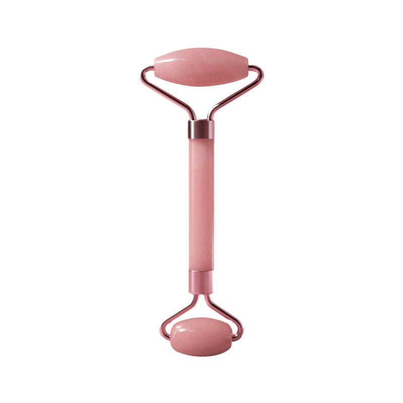 A pink resin facial massage roller set with a handle and two rollers.