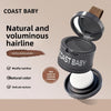 A dark gray cosmetic product called Coast Baby hairline shadow powder in an open compact with a white brush visible.