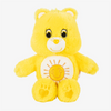 A yellow Classic Care Bears plush stuffed animal doll with a smiling sun design on its chest.
