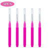 A set of five mini brow and eyelash combs in bright pink.