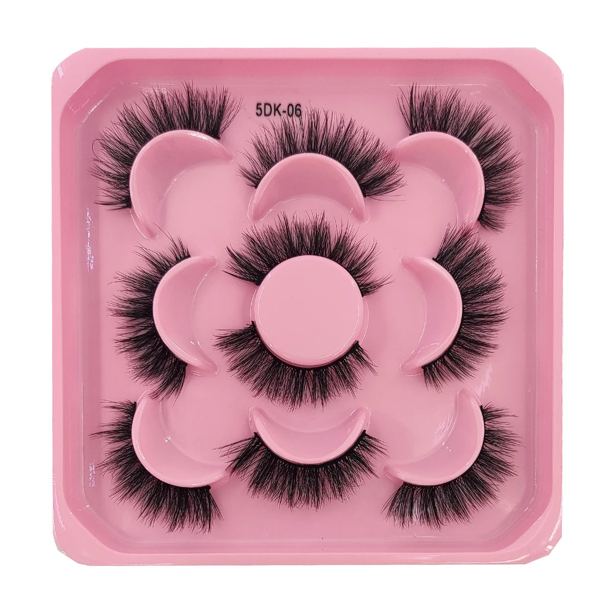 A pink tray holding a set of black artificial mink eyelashes for eye extensions.
