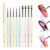A set of professional nail art brushes in various shades of pink and green for detailed painting