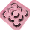 A pink tray holding a set of artificial mink eyelashes for eye extensions.