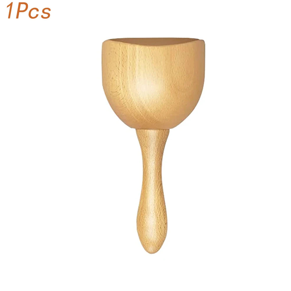 A natural wood gua sha roller with a rounded top and tapered handle.