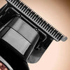 Close-up view of a black powder metallurgy blade on a professional cordless electric hair clipper.
