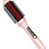 A pink infrared heated round brush with black bristles is shown in a close-up view.