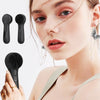 A woman is shown using a black silicone facial cleansing brush and accessories for skincare.