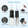 A portable electric water flosser with a clear tank and black body, showing power button, LED indicator, and charging port de
