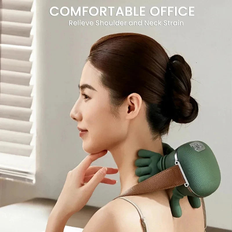A woman is using a green shiatsu massager on her neck and shoulder to relieve strain.