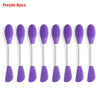 Ocho cepillos de silicona morados para limpieza facial y mascarillas, mostrados en fila.