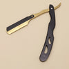 A professional stainless steel shaver and beard razor kit with a gold handle and black blade.