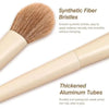 A close-up view of a makeup brush with synthetic fiber bristles and thickened aluminum tubes for application.