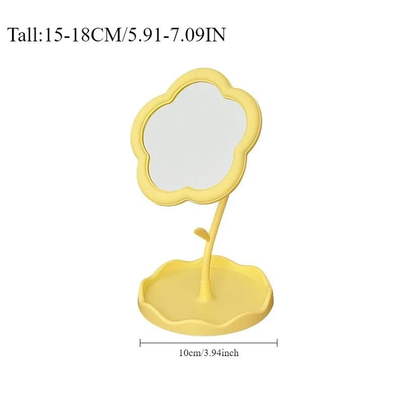 Miroir de bureau floral jaune avec cadre festonné et pied surélevé.
