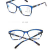 A pair of blue-framed progressive multifocal reading glasses shown from the front and back.