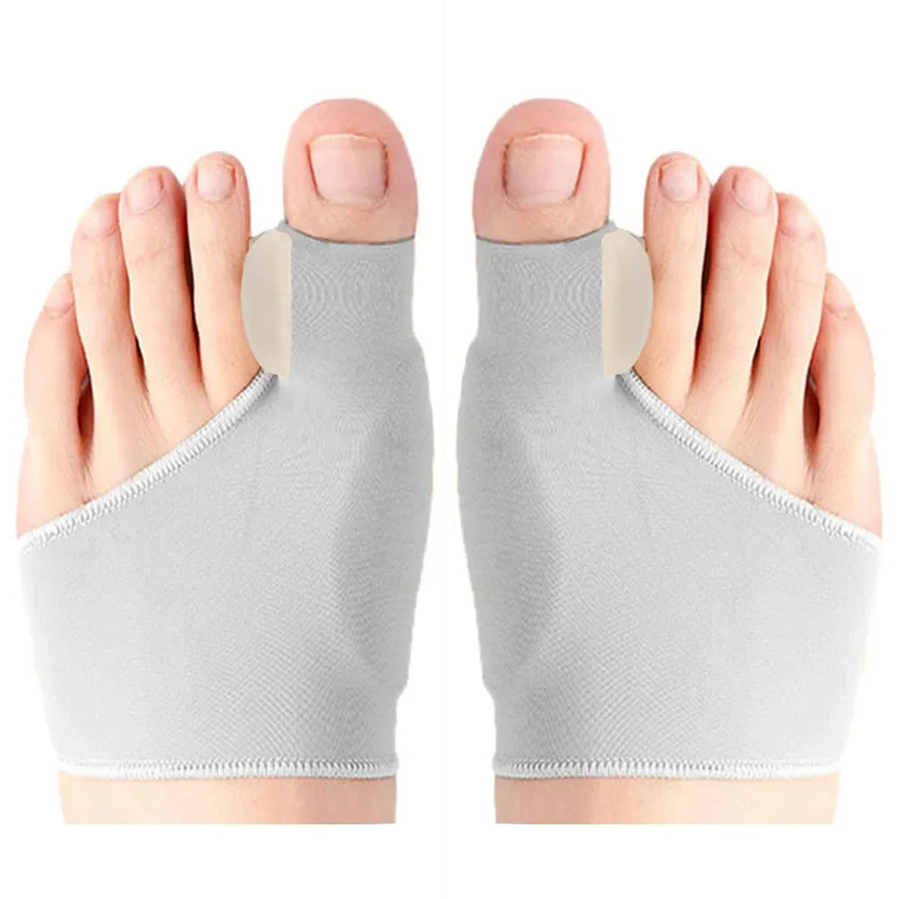 A pair of gray orthopedic toe separators and corrector pads shown from the top view.