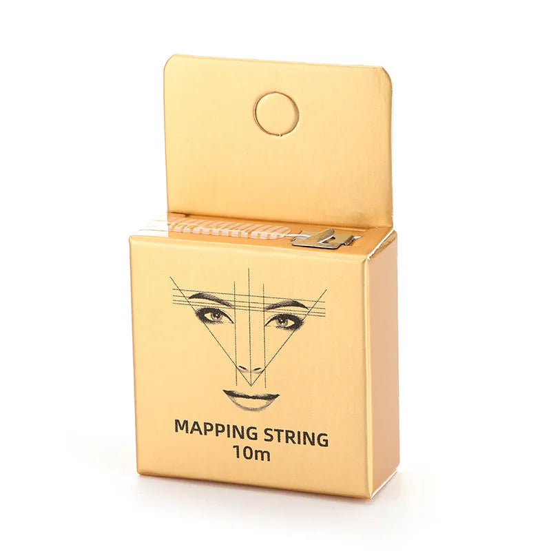 A gold cardboard box containing a pre-inked eyebrow mapping string measuring 10 meters.