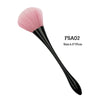 A pink rose gold nail dusting and makeup removal brush with a black handle.