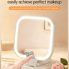 A hand touches a white LED makeup mirror with a light ring, demonstrating smart touch control for perfect makeup application.