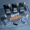 A set of replacement foil shaver blades and a shaving head are displayed on a dark gray surface.
