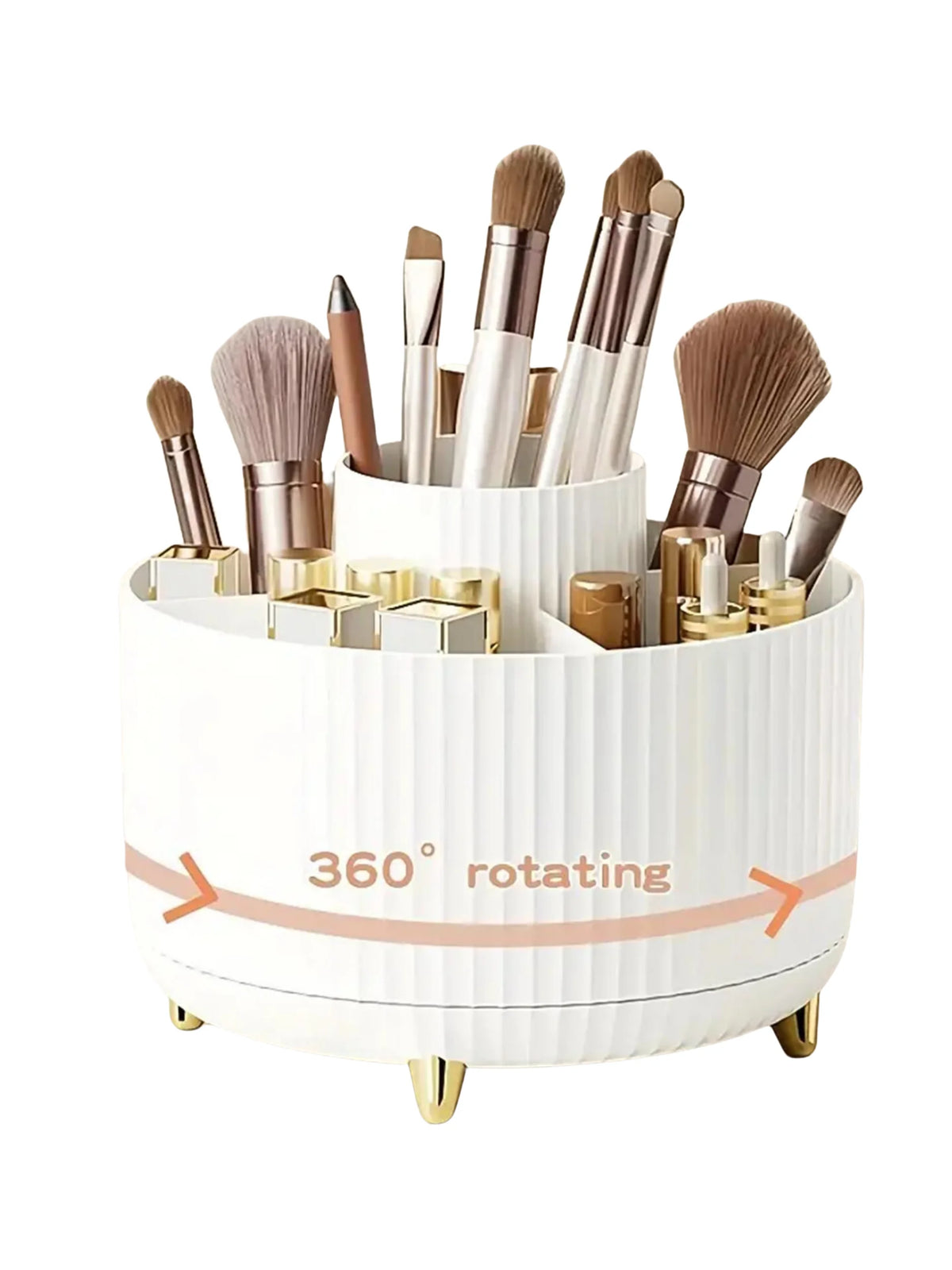A white rotating makeup organizer holding various gold and bronze makeup brushes and tools.