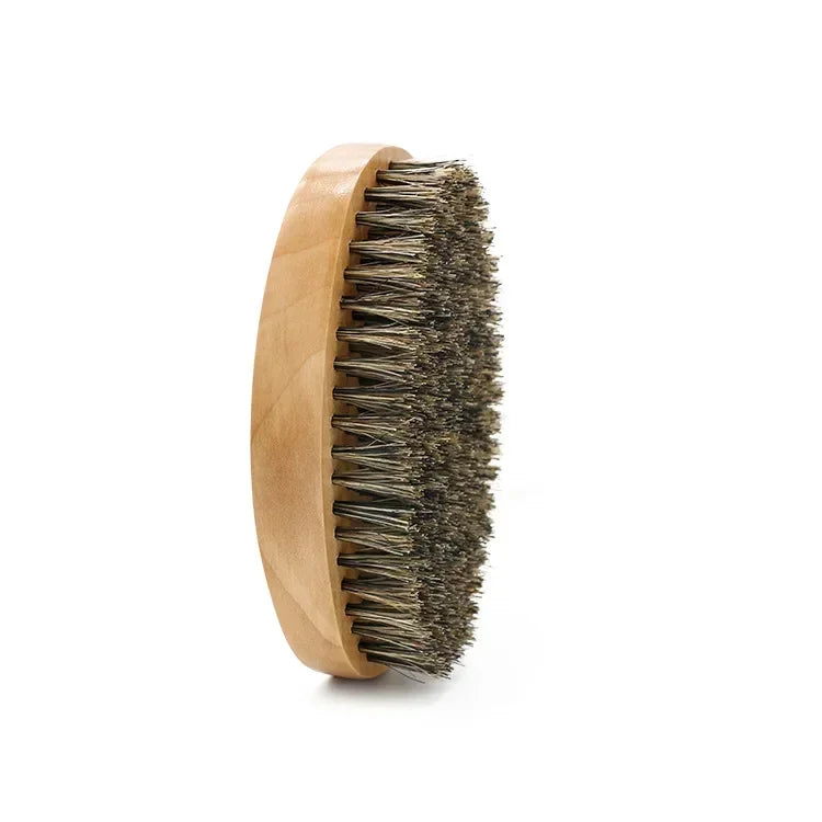 A wooden comb with boar bristles used for beard and mustache grooming.