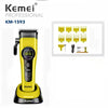 A yellow Kemei KM-1593 professional rechargeable hair clipper and trimmer set with multiple attachments.