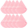 A set of pink reusable velvet powder puffs arranged in two rows.