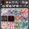 A collection of 3D floral butterfly pearl nail art charms in various shades of pink, purple, and green.
