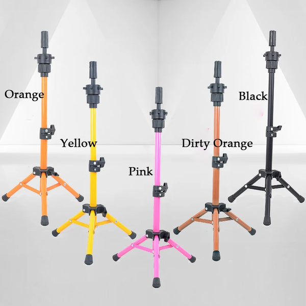 A collection of adjustable wig stands in orange, yellow, black, dirty orange, and pink, displayed against a white background.