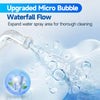 Close-up of an electric water flosser creating a micro bubble waterfall flow for thorough cleaning.