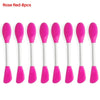 Ocho cepillos de silicona rosa y rojo para limpiar y mascarillas faciales, mostrados uno al lado del otro.