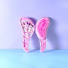 Peine de masaje de silicona rosa con cabeza brillante y marca KPOP Demon Hunter.