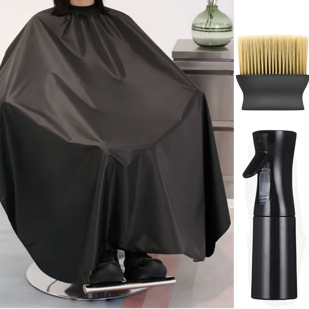 Tablier professionnel noir pour coupe de cheveux drapé sur un support à côté d'un peigne et d'un support noirs.