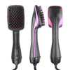 A black hair dryer brush and curling comb with pink accents shown in three views.