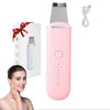 A pink ultrasonic skin scrubber face tool is shown next to its packaging and charging cable.