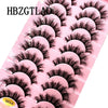 Plateau en plastique rose contenant plusieurs jeux d'extensions de cils de renard noirs