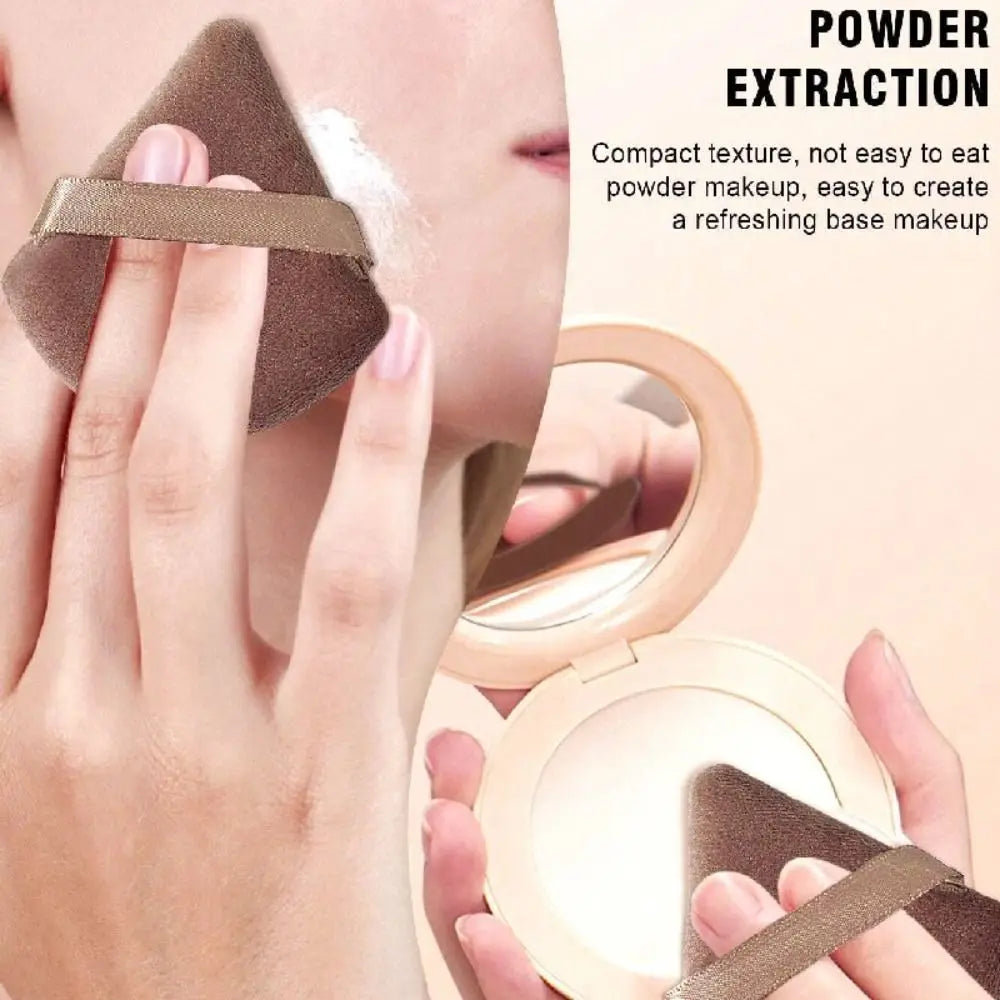 A hand is using a powder extraction tool to apply compact texture powder makeup on the face.