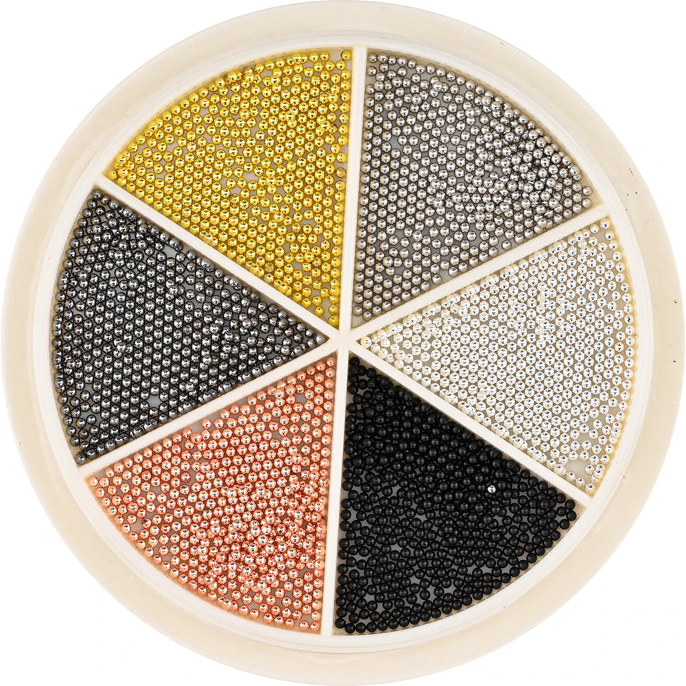 A circular display of various colored mixed stainless steel beads for nail art decorations.